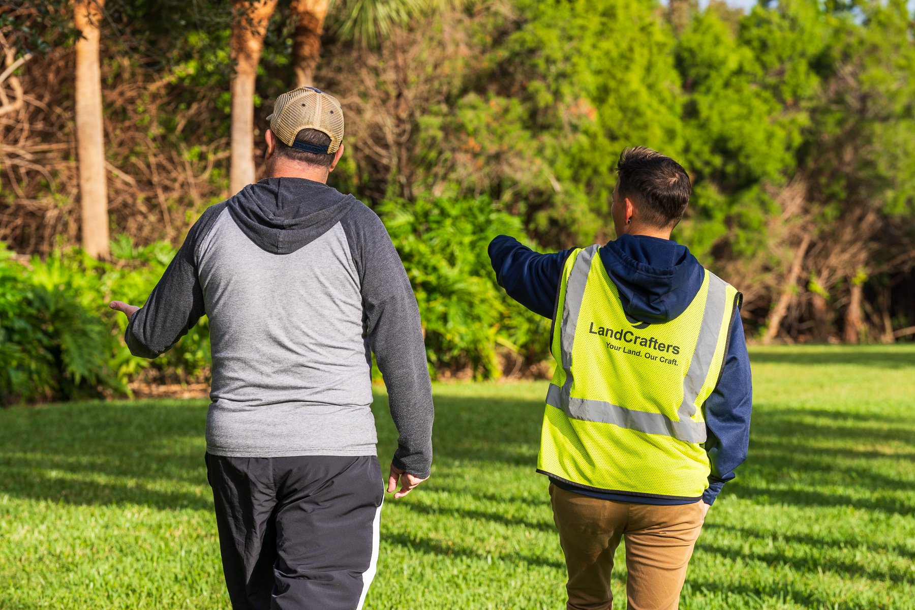 Account manager walking with HOA board member around property 1