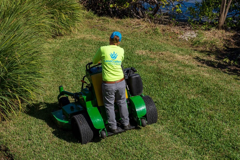 landscaper mowing lawn in Tampa Bay