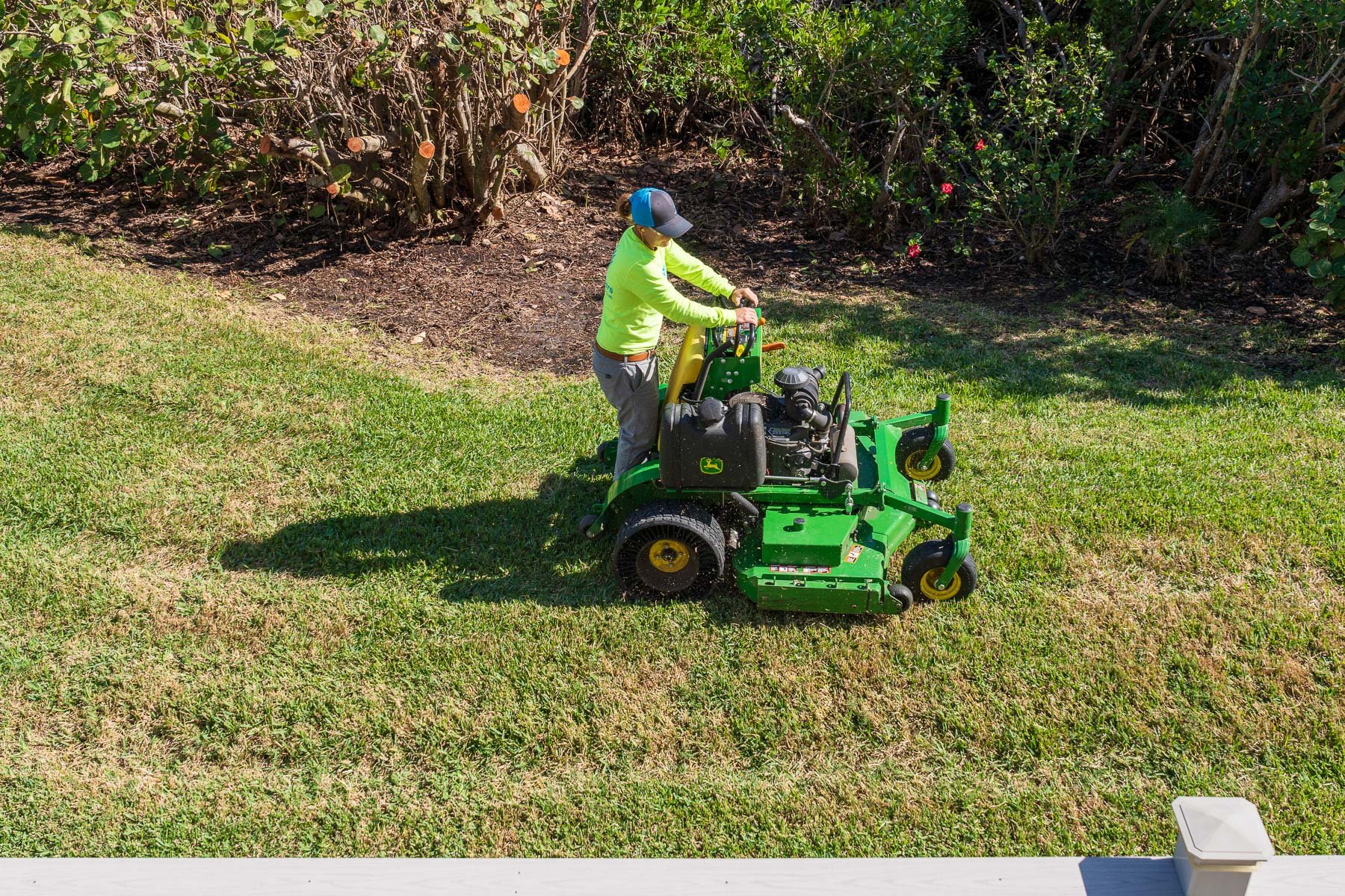 Landscape maintenance crew mowing