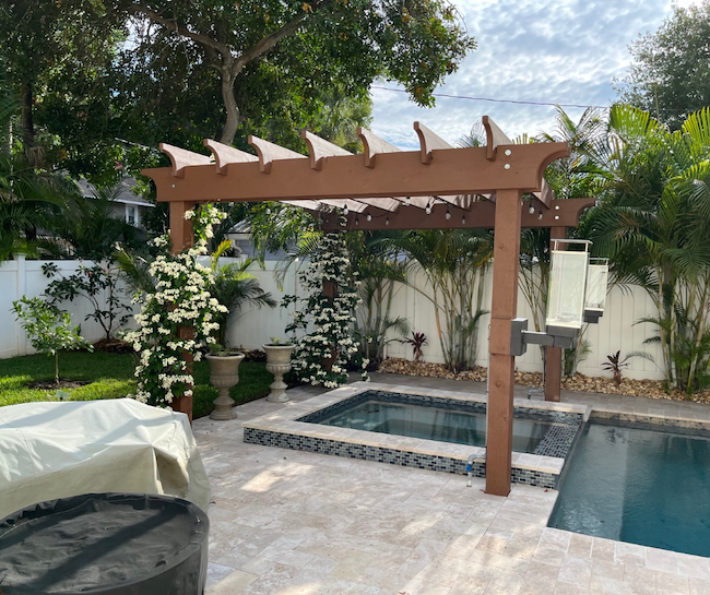 Backyard spa with shade trellis and pool