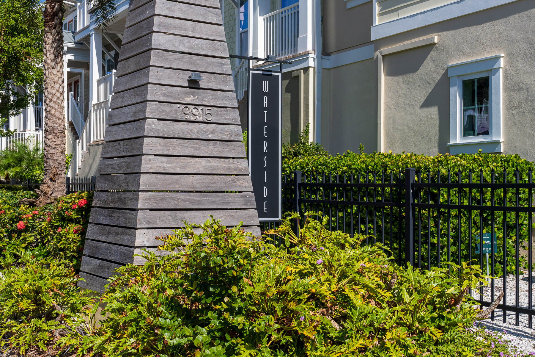 landscape maintenance garden beds near sign