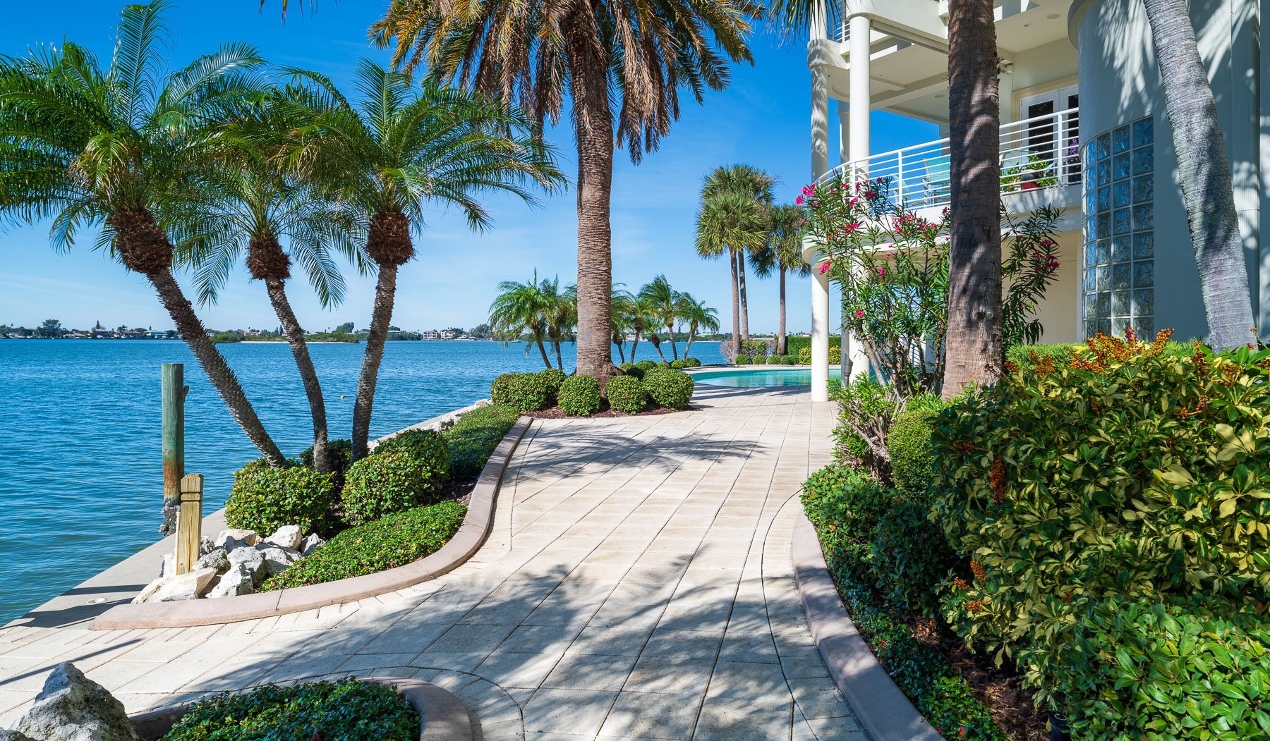 residential landscape mainteance garden beds along water 1