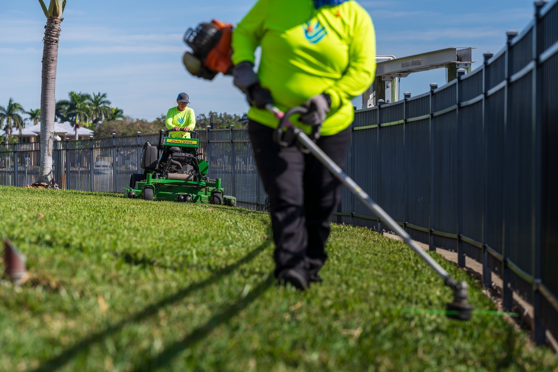 residential landscape maintenance crew edging and mowing 1