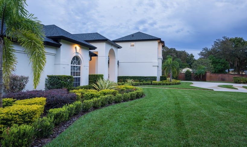 residential landscape side of front yard with garden beds